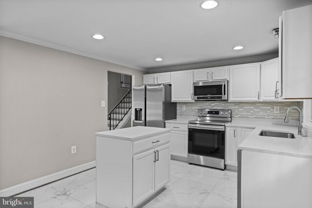 5908 Michael Rd, Waldorf, MD 20601 - kitchen featuring appliances with stainless steel finishes, a sink, light marble finish floors, ornamental molding, and recessed lighting