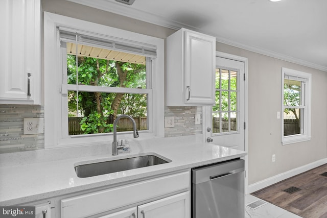 5908 Michael Rd, Waldorf, MD 20601 - kitchen with dishwasher, a sink, ornamental molding, white cabinetry, and decorative backsplash
