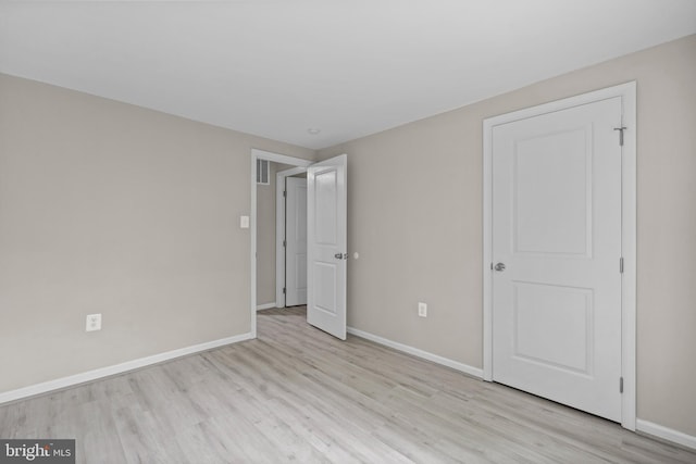 5908 Michael Rd, Waldorf, MD 20601 - unfurnished bedroom featuring wood finished floors and baseboards
