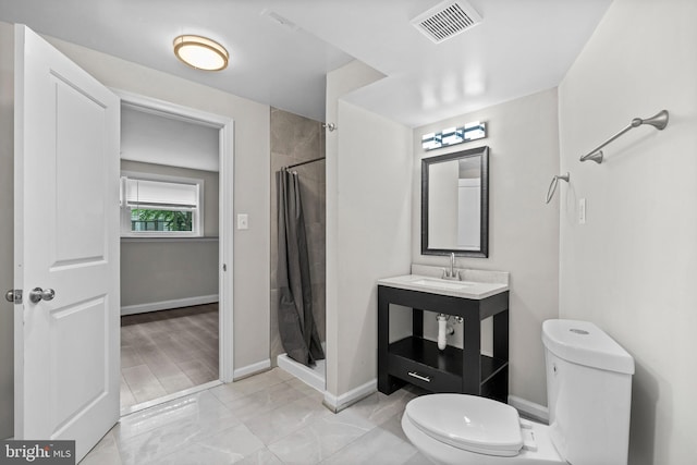 5908 Michael Rd, Waldorf, MD 20601 - full bath featuring toilet, a stall shower, baseboards, and vanity