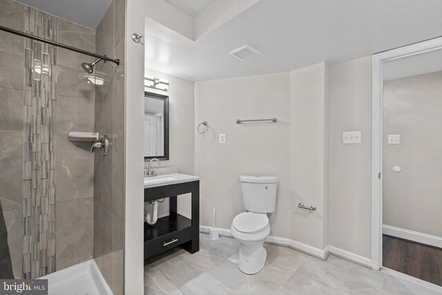 5908 Michael Rd, Waldorf, MD 20601 - bathroom with toilet, a stall shower, vanity, and baseboards