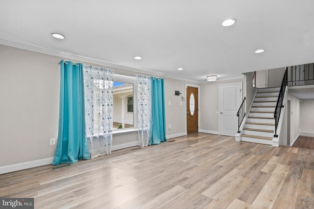5908 Michael Rd, Waldorf, MD 20601 - unfurnished living room with crown molding, stairway, wood finished floors, baseboards, and recessed lighting