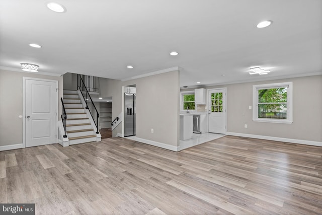 5908 Michael Rd, Waldorf, MD 20601 - unfurnished living room with crown molding, recessed lighting, stairs, baseboards, and light wood-style floors