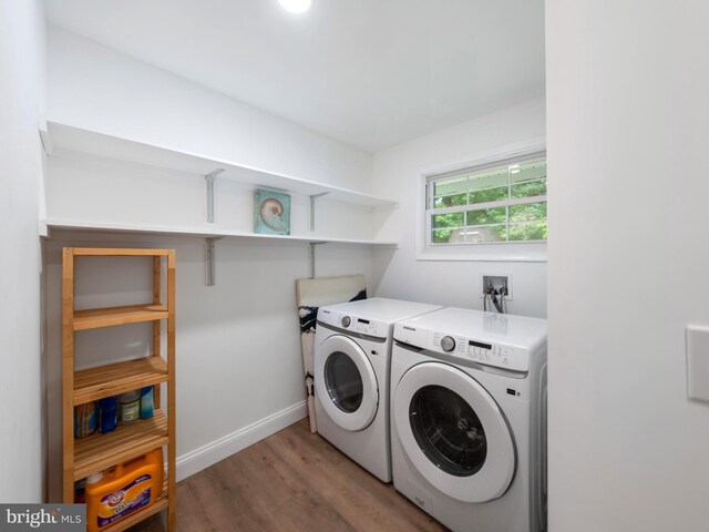 5503 Blacksburg Rd, Springfield, VA 22151 - laundry area featuring washing machine and dryer, light wood-style floors, and baseboards