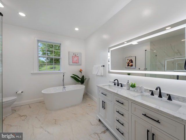 5503 Blacksburg Rd, Springfield, VA 22151 - full bath with baseboards, a marble finish shower, double vanity, recessed lighting, and a freestanding tub