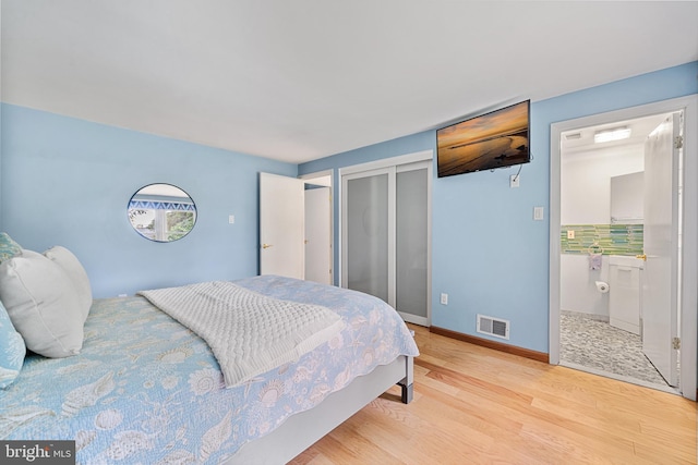 1918 Michael Rd, Waldorf, MD 20601 - bedroom featuring light wood finished floors, a closet, baseboards, and ensuite bathroom