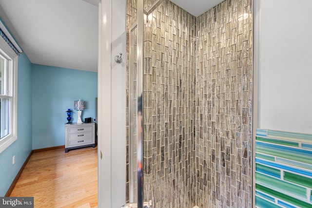 1918 Michael Rd, Waldorf, MD 20601 - bathroom featuring a tile shower, healthy amount of natural light, and wood finished floors