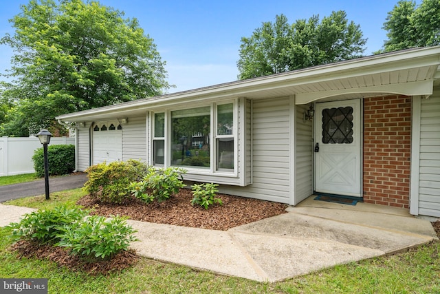 1918 Michael Rd, Waldorf, MD 20601 - property entrance with driveway, a garage, and brick siding