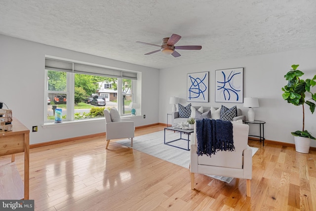 1918 Michael Rd, Waldorf, MD 20601 - living room featuring ceiling fan, a textured ceiling, baseboards, and wood finished floors