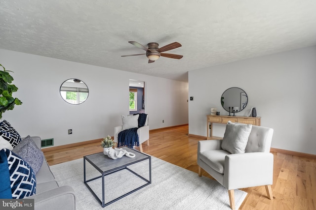 1918 Michael Rd, Waldorf, MD 20601 - living area featuring a ceiling fan, baseboards, light wood finished floors, and a textured ceiling