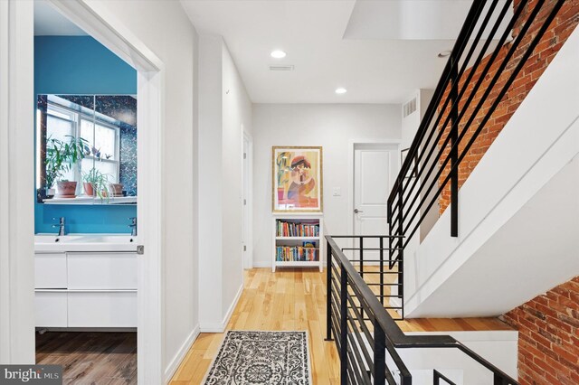 810 S 49th St, Philadelphia, PA 19143 - hall with light wood-style floors, baseboards, stairs, and recessed lighting