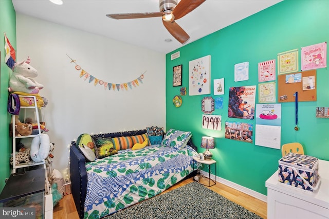 810 S 49th St, Philadelphia, PA 19143 - bedroom with wood finished floors and a ceiling fan