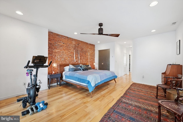 810 S 49th St, Philadelphia, PA 19143 - bedroom with brick wall, wood finished floors, recessed lighting, and a ceiling fan
