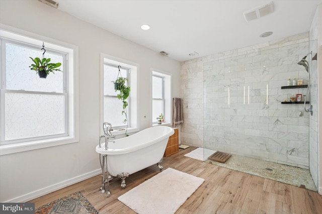 810 S 49th St, Philadelphia, PA 19143 - full bath featuring a freestanding bath, tiled shower, wood finished floors, and baseboards