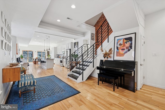 810 S 49th St, Philadelphia, PA 19143 - foyer with light wood-style floors, stairway, baseboards, and recessed lighting