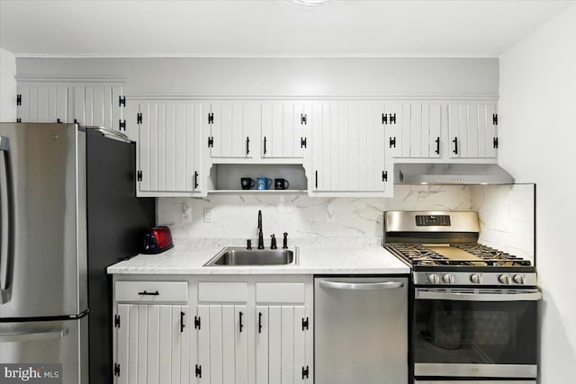 9272 Adelphi Unit 103, Hyattsville, MD 20783 - kitchen featuring appliances with stainless steel finishes, a sink, exhaust hood, backsplash, and open shelves