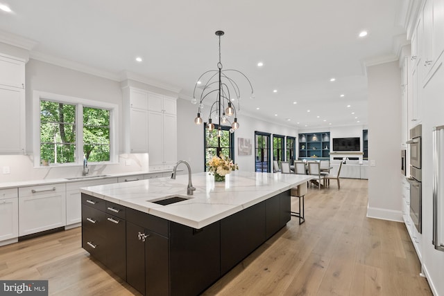 825 Whann Ave, Mclean, VA 22101 - kitchen with a sink, white cabinets, recessed lighting, a large island, and ornamental molding