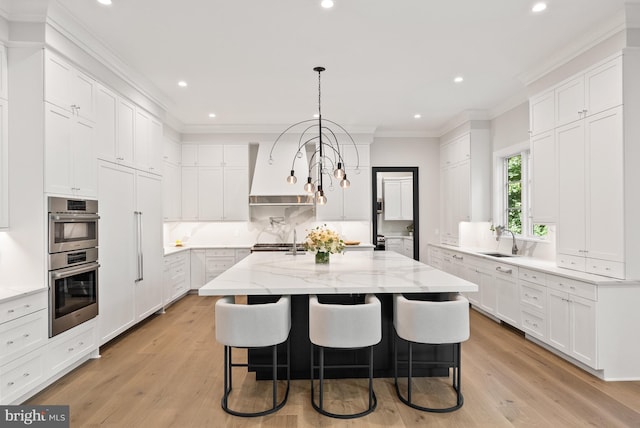 825 Whann Ave, Mclean, VA 22101 - kitchen featuring custom range hood, a sink, stainless steel double oven, crown molding, and a kitchen island