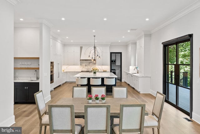825 Whann Ave, Mclean, VA 22101 - dining room with light wood-style flooring, recessed lighting, baseboards, and crown molding