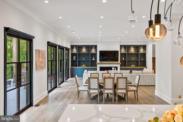 825 Whann Ave, Mclean, VA 22101 - dining space with light wood-style flooring, baseboards, recessed lighting, ornamental molding, and a warm lit fireplace