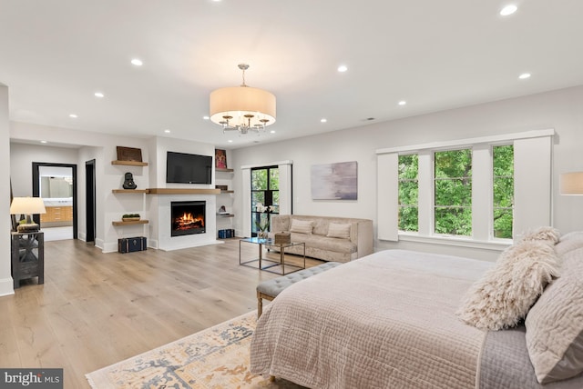 825 Whann Ave, Mclean, VA 22101 - bedroom with recessed lighting, light wood finished floors, a lit fireplace, a chandelier, and baseboards