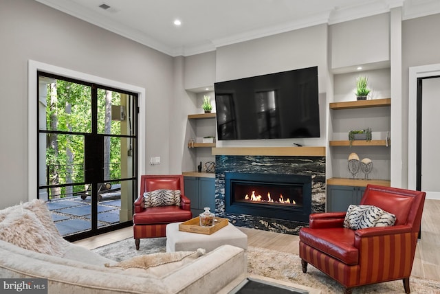 825 Whann Ave, Mclean, VA 22101 - living room featuring crown molding, a premium fireplace, wood finished floors, built in features, and recessed lighting