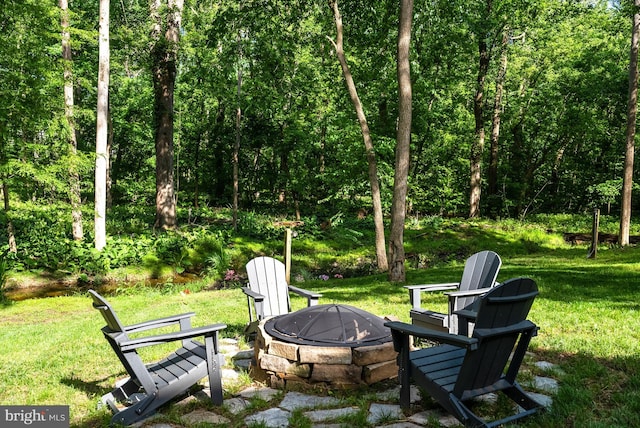 825 Whann Ave, Mclean, VA 22101 - view of grassy yard with an outdoor fire pit and a forest view