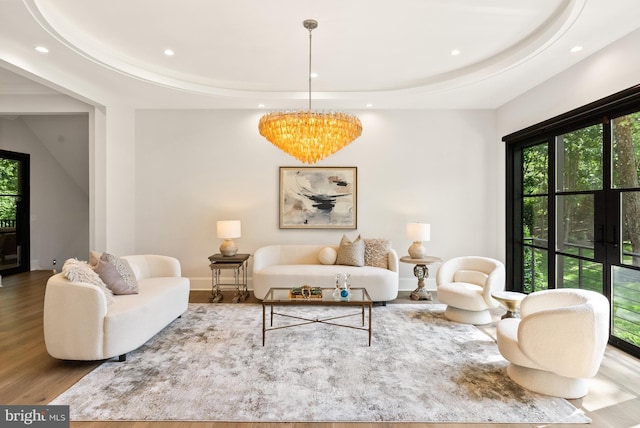 825 Whann Ave, Mclean, VA 22101 - living room with healthy amount of natural light, recessed lighting, wood finished floors, a chandelier, and a tray ceiling