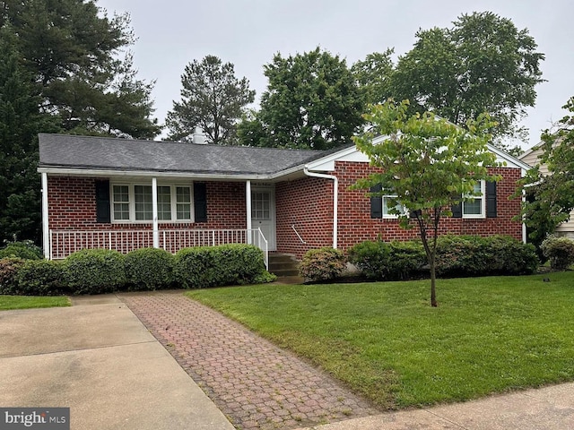 9207 Snyder Ln, Perry Hall, MD 21128 - view of front of house with brick siding, a front lawn, and a porch
