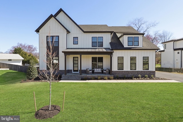 1749 Beulah Rd, Vienna, VA 22182 - modern farmhouse featuring a standing seam roof, covered porch, board and batten siding, roof with shingles, and metal roof