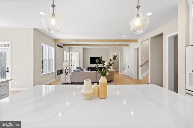 1749 Beulah Rd, Vienna, VA 22182 - kitchen with recessed lighting, light stone counters, white cabinetry, pendant lighting, and open floor plan