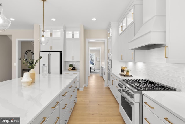 1749 Beulah Rd, Vienna, VA 22182 - kitchen with white appliances, premium range hood, white cabinets, light wood-type flooring, and recessed lighting