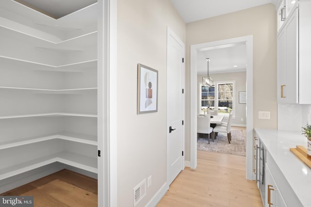1749 Beulah Rd, Vienna, VA 22182 - hallway with light wood-style flooring and baseboards