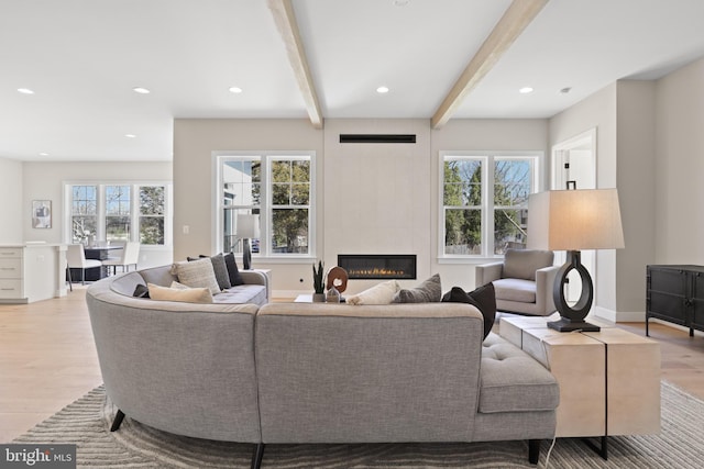 1749 Beulah Rd, Vienna, VA 22182 - living area featuring light wood-type flooring, beamed ceiling, a fireplace, recessed lighting, and baseboards