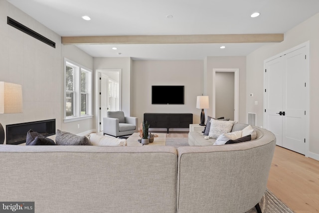 1749 Beulah Rd, Vienna, VA 22182 - living area with light wood finished floors, beam ceiling, recessed lighting, and baseboards