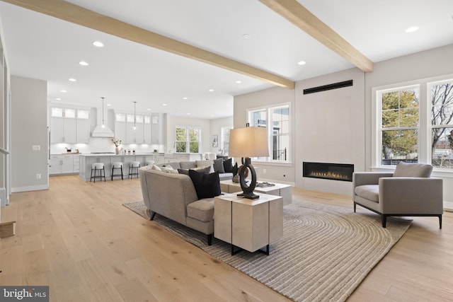 1749 Beulah Rd, Vienna, VA 22182 - living area with light wood finished floors, beam ceiling, a tile fireplace, recessed lighting, and baseboards