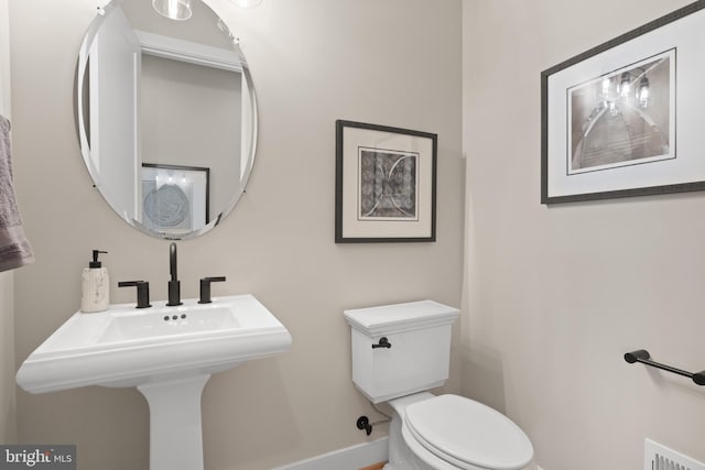 1749 Beulah Rd, Vienna, VA 22182 - half bath featuring toilet and baseboards