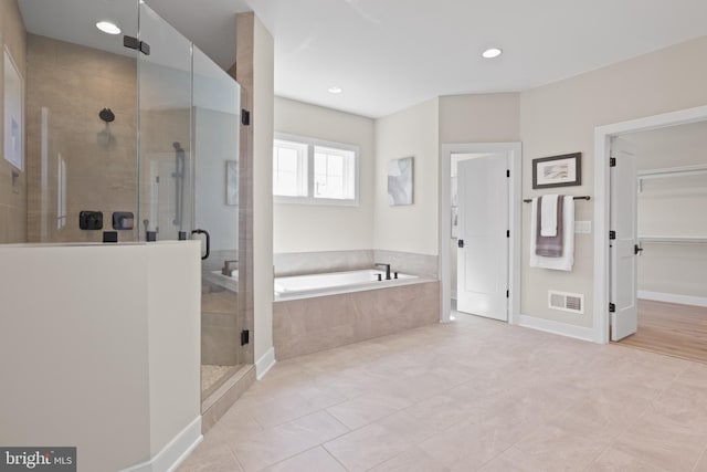 1749 Beulah Rd, Vienna, VA 22182 - bathroom with a bath, a shower stall, tile patterned floors, and recessed lighting