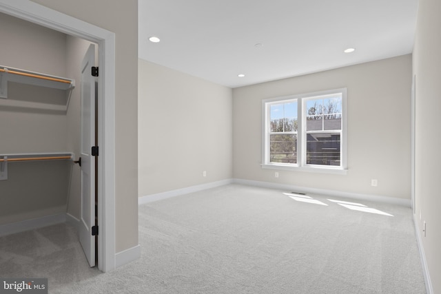 1749 Beulah Rd, Vienna, VA 22182 - unfurnished bedroom with carpet flooring, a walk in closet, baseboards, recessed lighting, and a closet