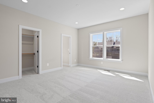 1749 Beulah Rd, Vienna, VA 22182 - unfurnished bedroom featuring carpet, a spacious closet, baseboards, and recessed lighting