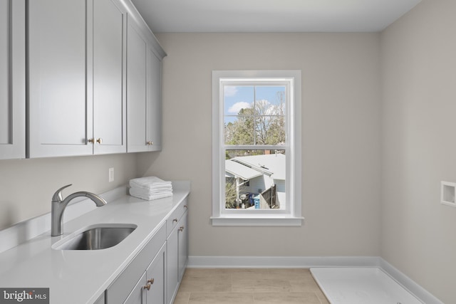 1749 Beulah Rd, Vienna, VA 22182 - washroom with cabinet space, baseboards, and light tile patterned floors