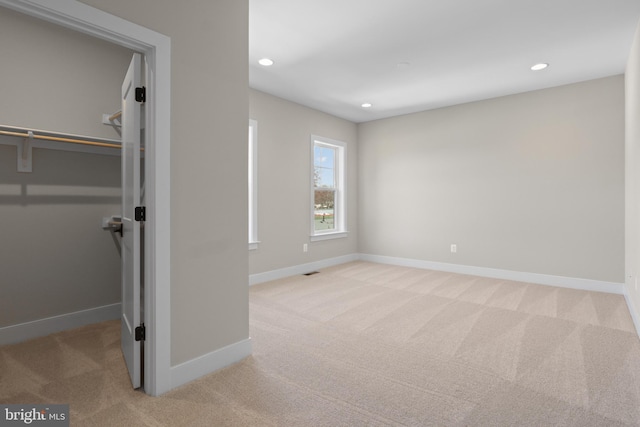 1749 Beulah Rd, Vienna, VA 22182 - unfurnished bedroom with a walk in closet, carpet, baseboards, and recessed lighting