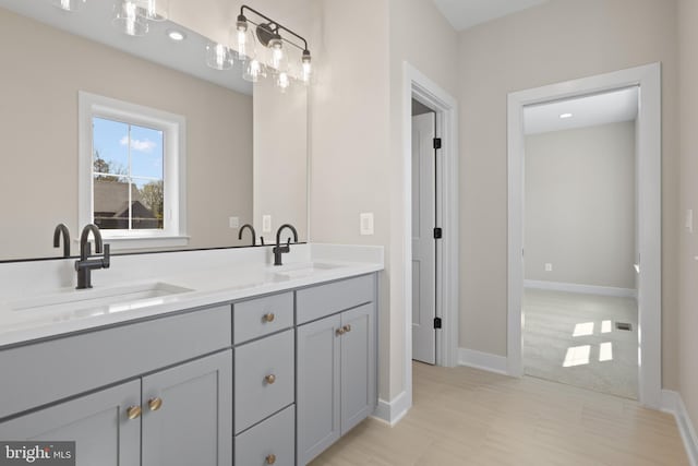 1749 Beulah Rd, Vienna, VA 22182 - bathroom with double vanity and baseboards