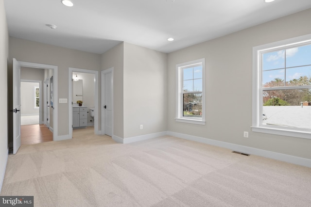 1749 Beulah Rd, Vienna, VA 22182 - unfurnished bedroom with light carpet, multiple windows, recessed lighting, and baseboards