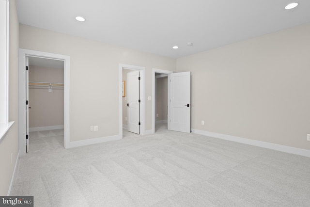 1749 Beulah Rd, Vienna, VA 22182 - unfurnished bedroom featuring carpet flooring, a spacious closet, recessed lighting, baseboards, and a closet