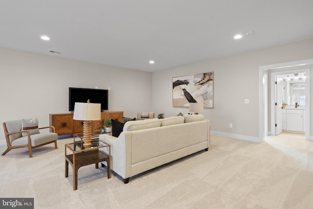 1749 Beulah Rd, Vienna, VA 22182 - living area with light colored carpet, recessed lighting, and baseboards