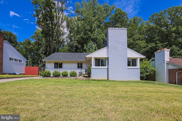 417 Nottingham Rd, Baltimore, MD 21229 - view of front facade featuring a chimney and a front yard