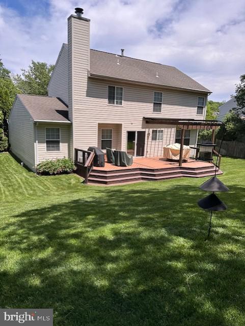 10512 Winged Elm Cir, Manassas, VA 20110 - back of house with a chimney and a wooden deck