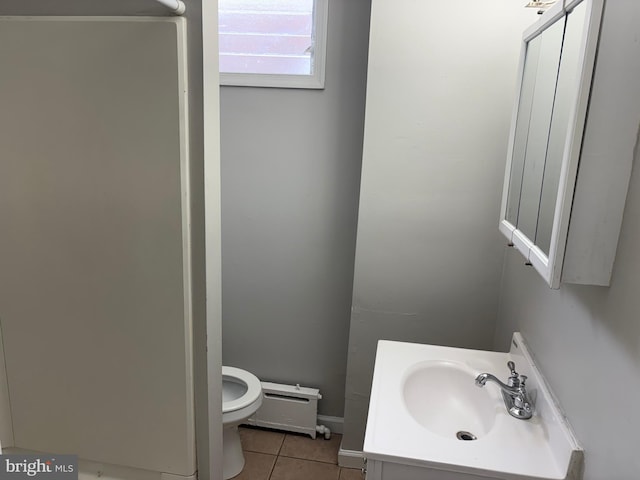 4728 Marple St, Philadelphia, PA 19136 - bathroom featuring toilet, a baseboard heating unit, tile patterned flooring, and vanity