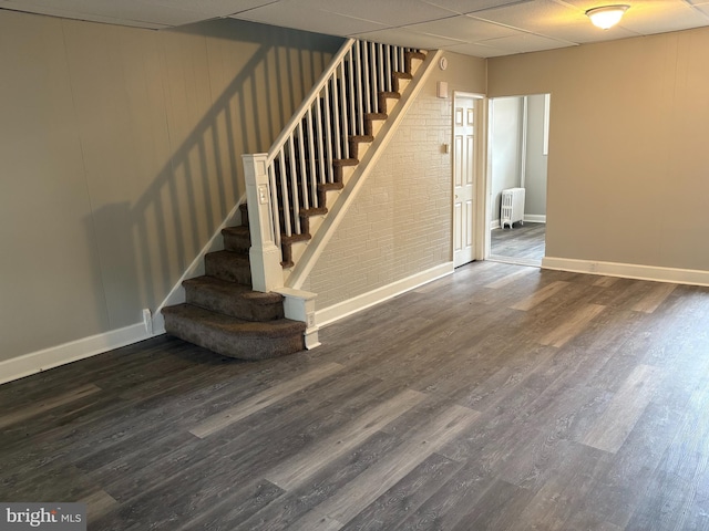 4728 Marple St, Philadelphia, PA 19136 - stairs featuring radiator, wood finished floors, baseboards, and a drop ceiling